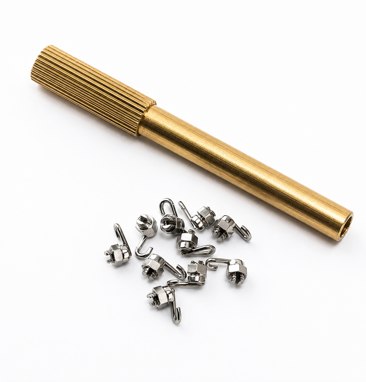 Gold cylindrical tool with small metal components on a white background