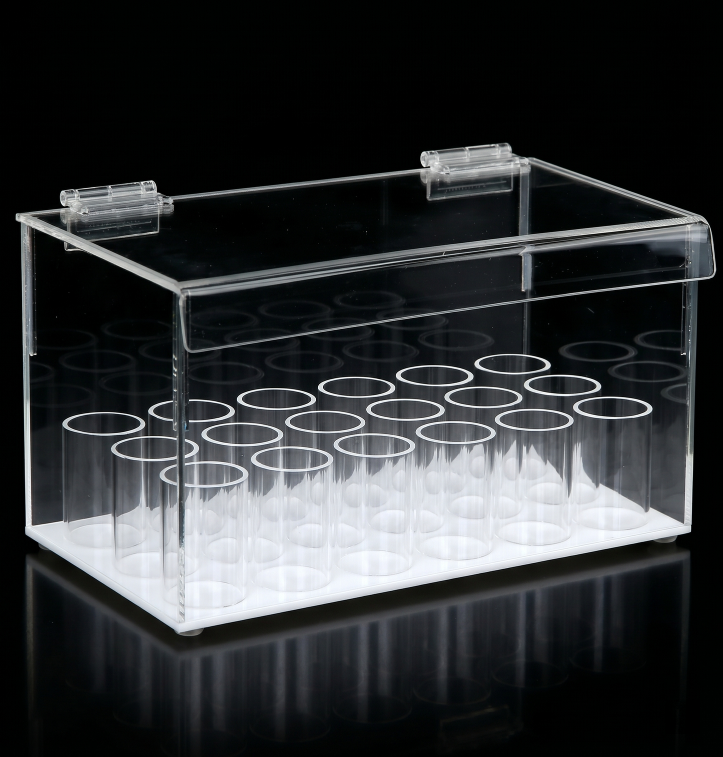 Clear plastic box with white lids on a black background