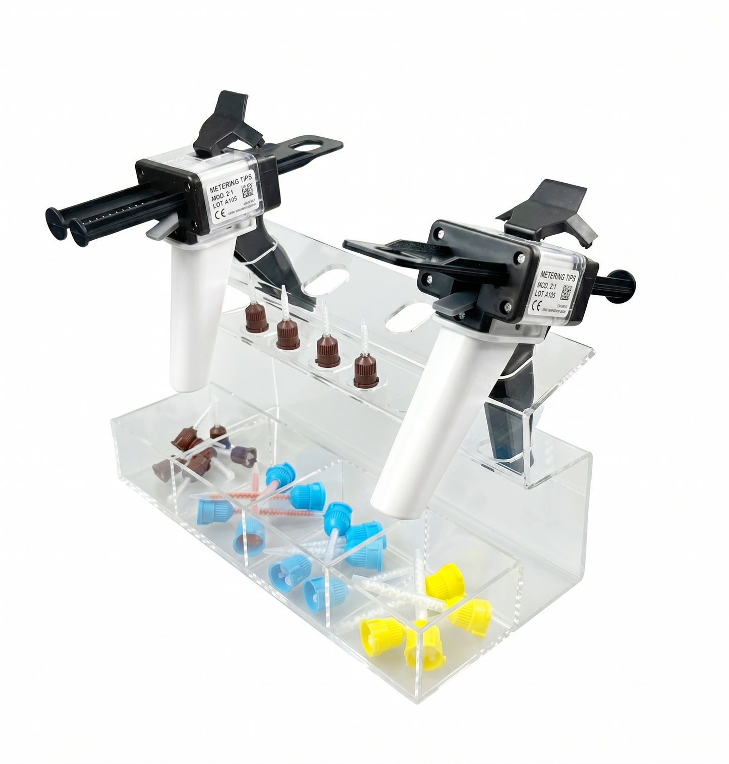 Two syringe holders with various colored tips on a clear stand against a white background