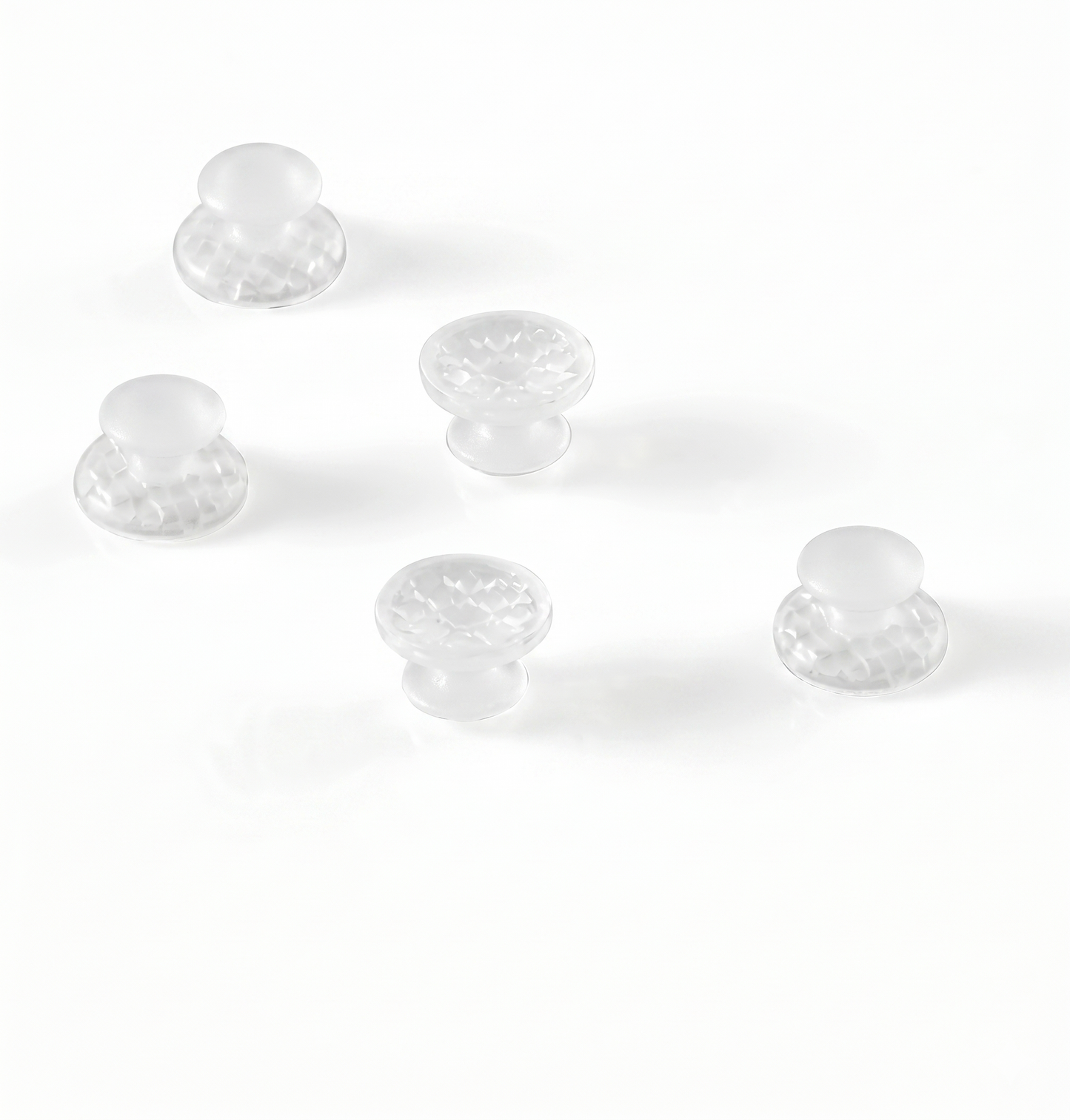 Clear plastic knobs on a white background