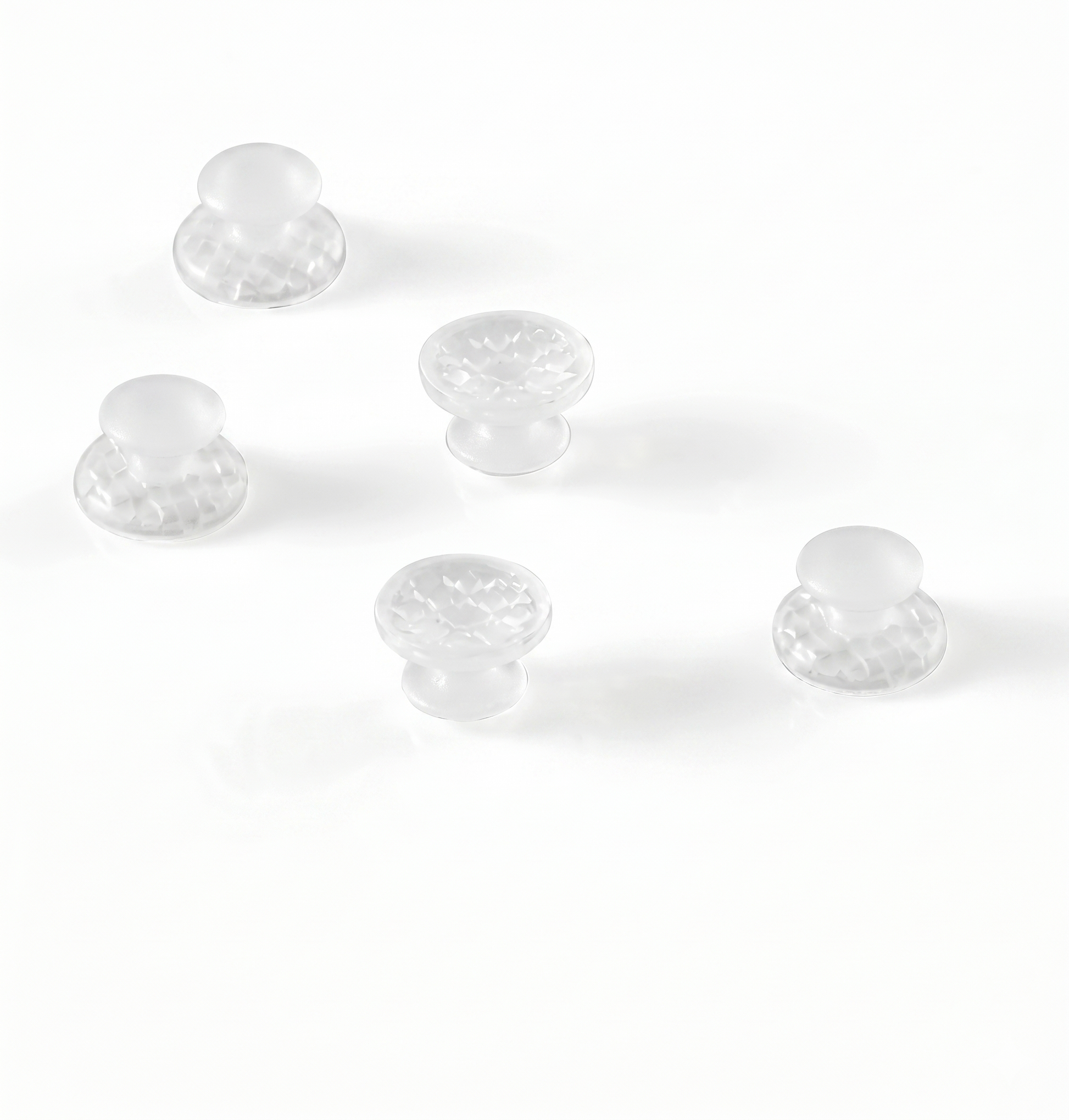 Clear plastic knobs on a white background