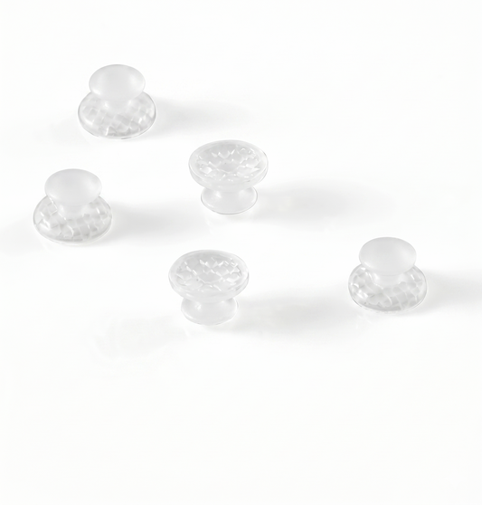 Clear plastic knobs on a white background