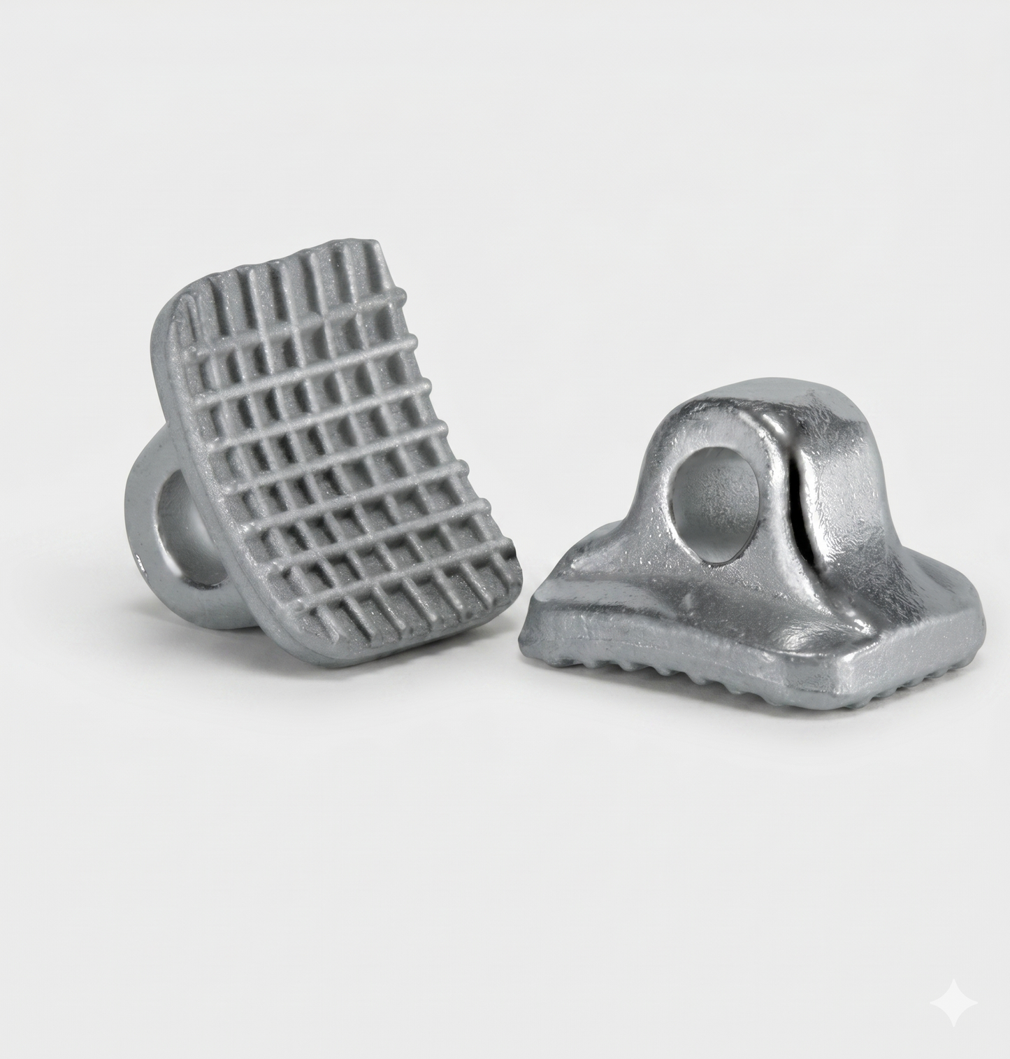 Two metal components on a white background