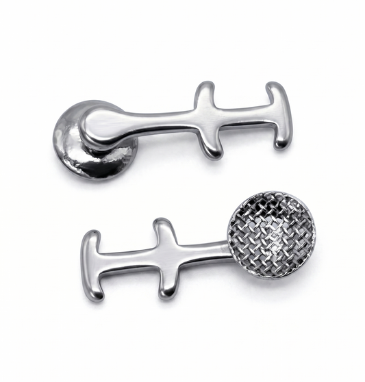 Silver double hool lingual buttonl on a white background