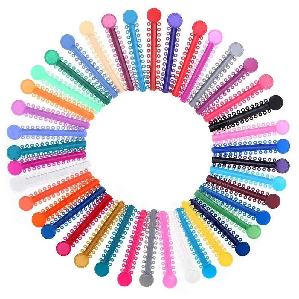 Assorted colorful ligature v ties arranged in a circular pattern on a white background