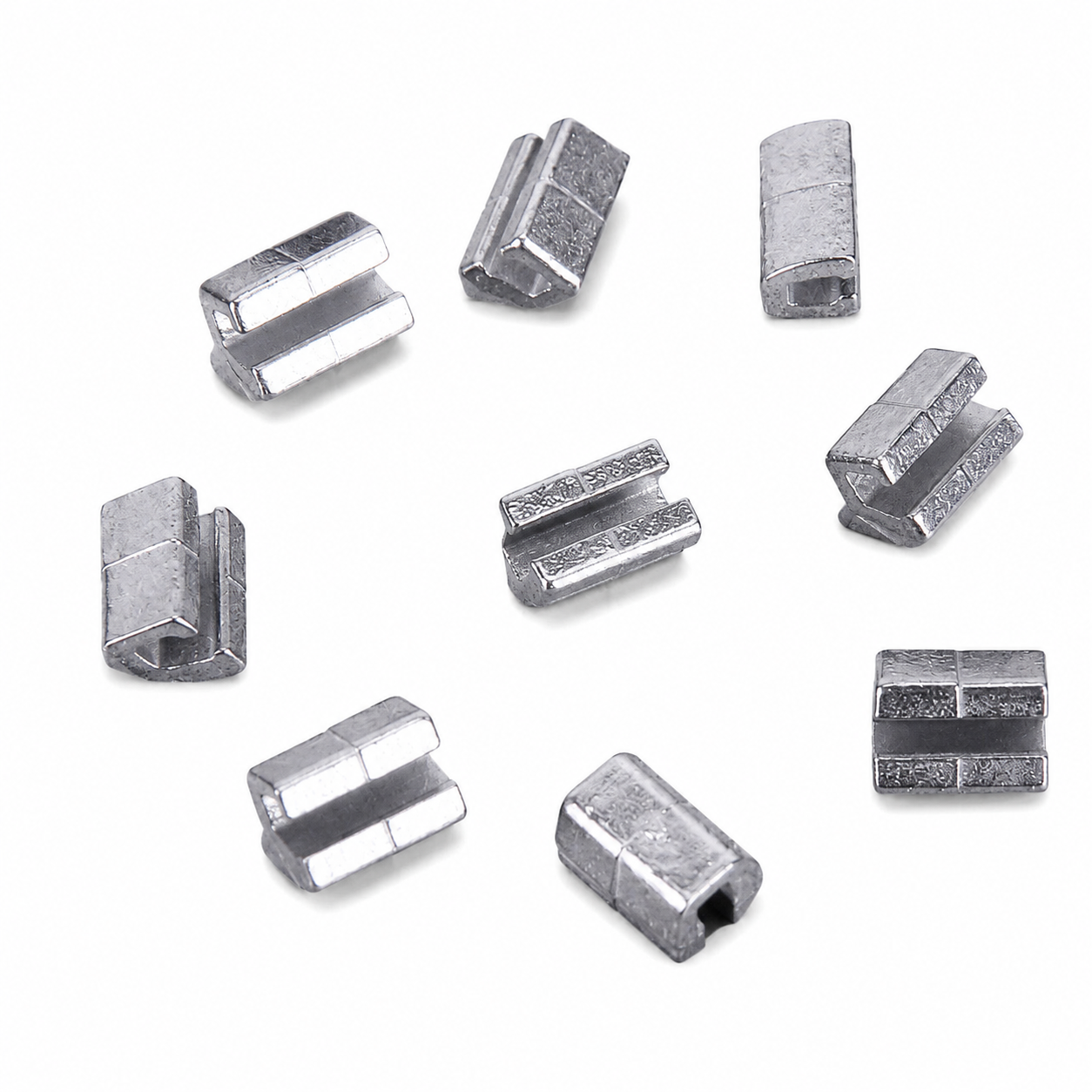 Silver metal Mini Crimpable Stops on a white background
