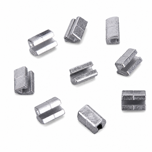 Silver metal Mini Crimpable Stops on a white background