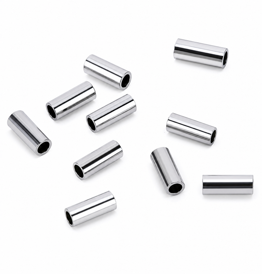 Silver cylindrical beads on a white background