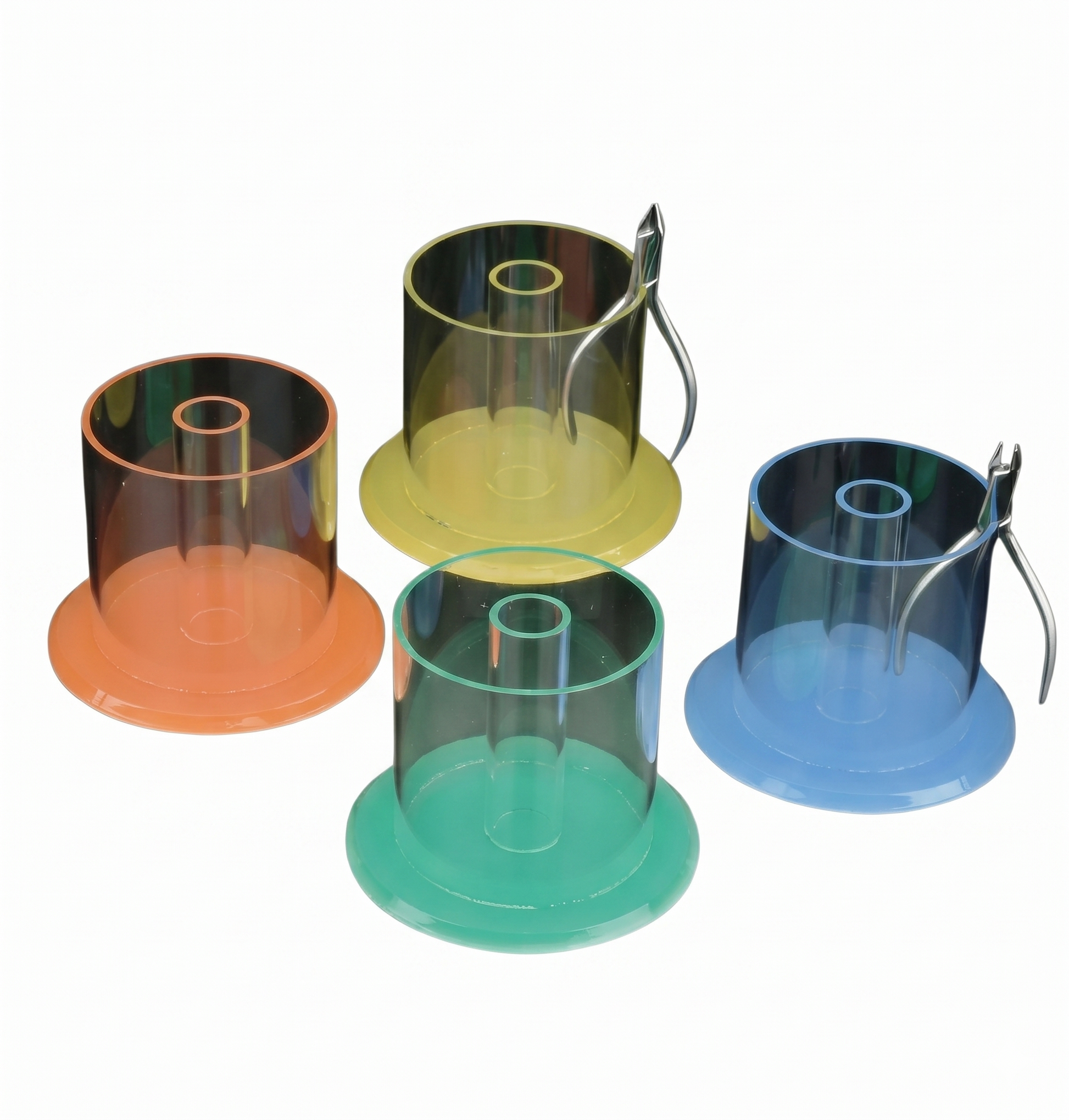 Set of four transparent plastic containers with colored bases on a white background