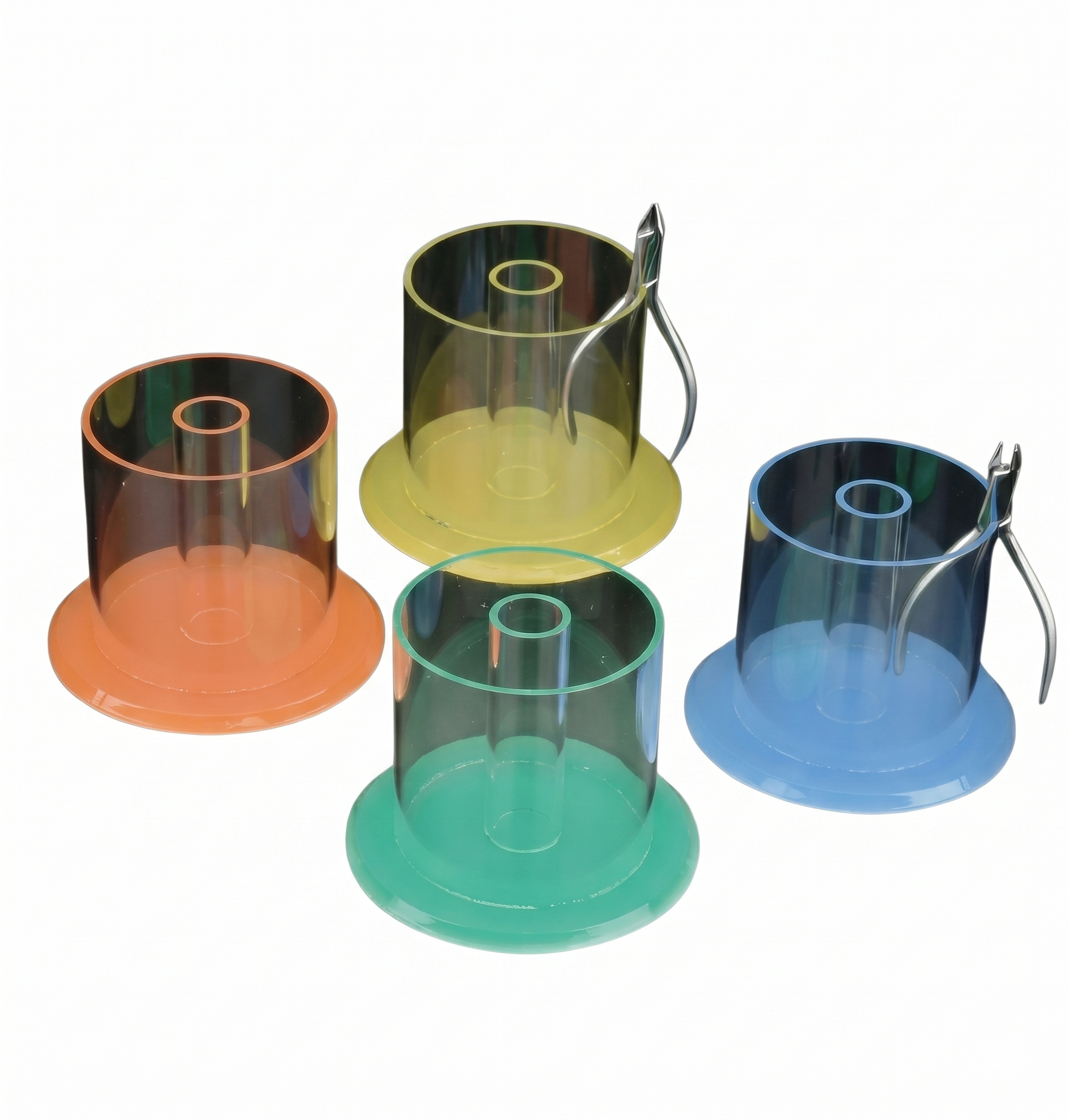 Set of four transparent plastic containers with colored bases on a white background