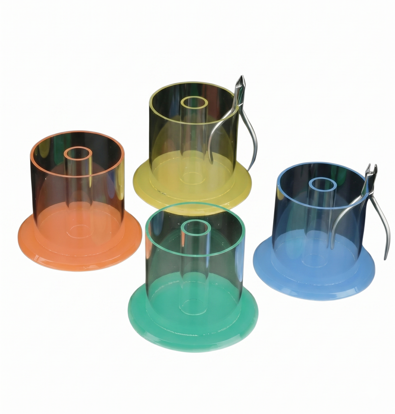 Set of four transparent plastic containers with colored bases on a white background