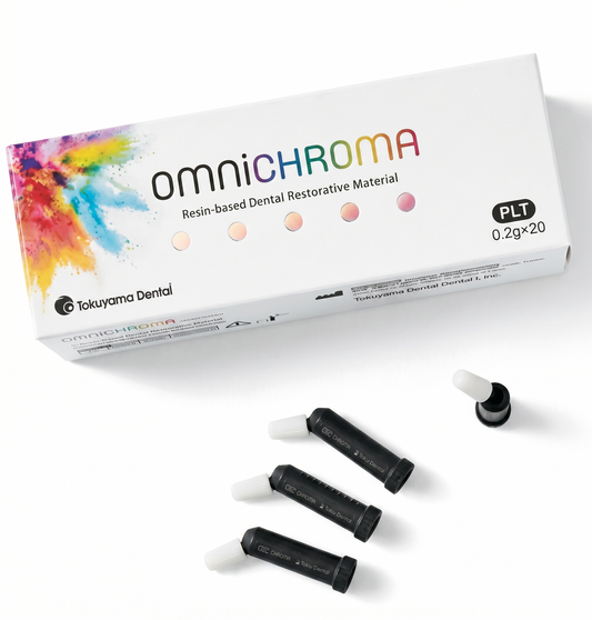 omnichroma resin-based dental restorative material packaging with four black tubes on a white background