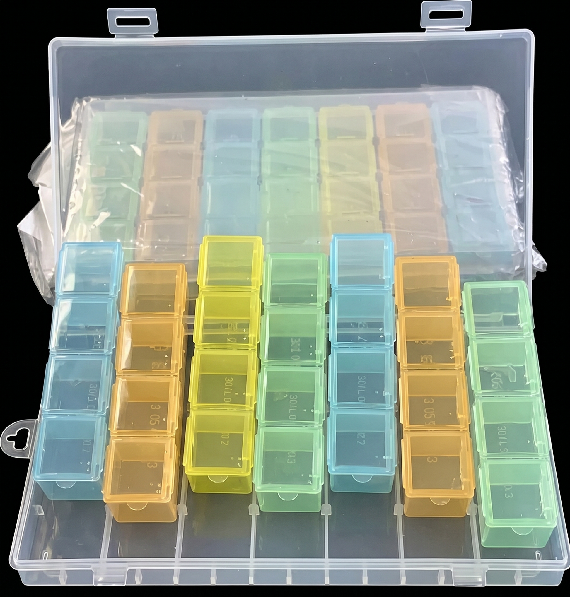 Clear plastic organizer with compartments containing small containers in various colors.