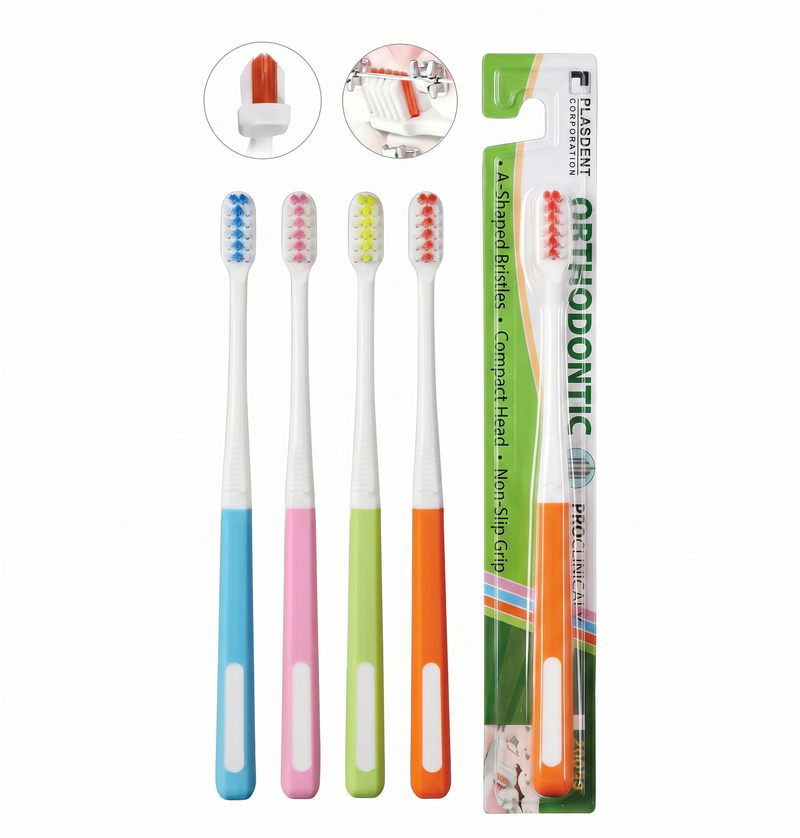 Set of colorful toothbrushes with a green orthodontic toothbrush packaging on a white background.