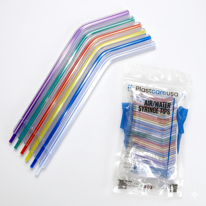 Colorful syringe tips with a package labeled 'PlastcareUSA' on a white background