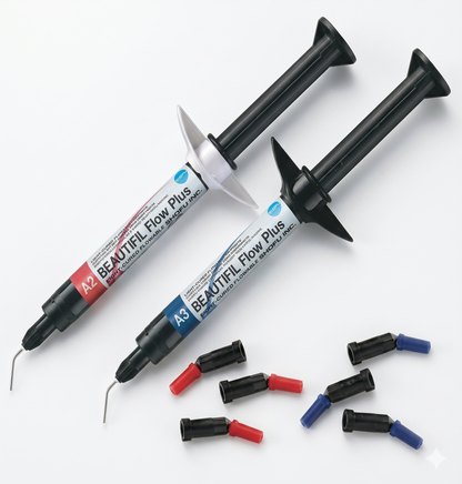 BEAUTIFUL Flow Plus dental materials with various nozzles on a white background