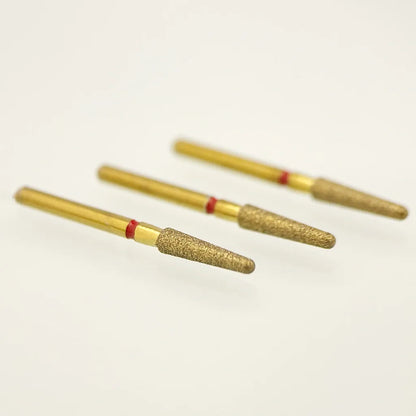 Three gold cylindrical objects with red bands on a white background