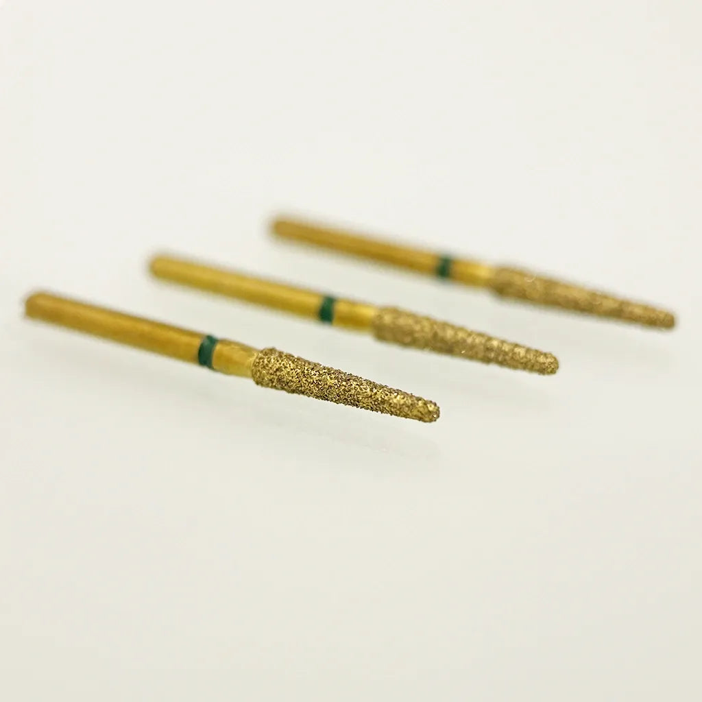 Three gold-colored cylindrical objects with green bands on a white background