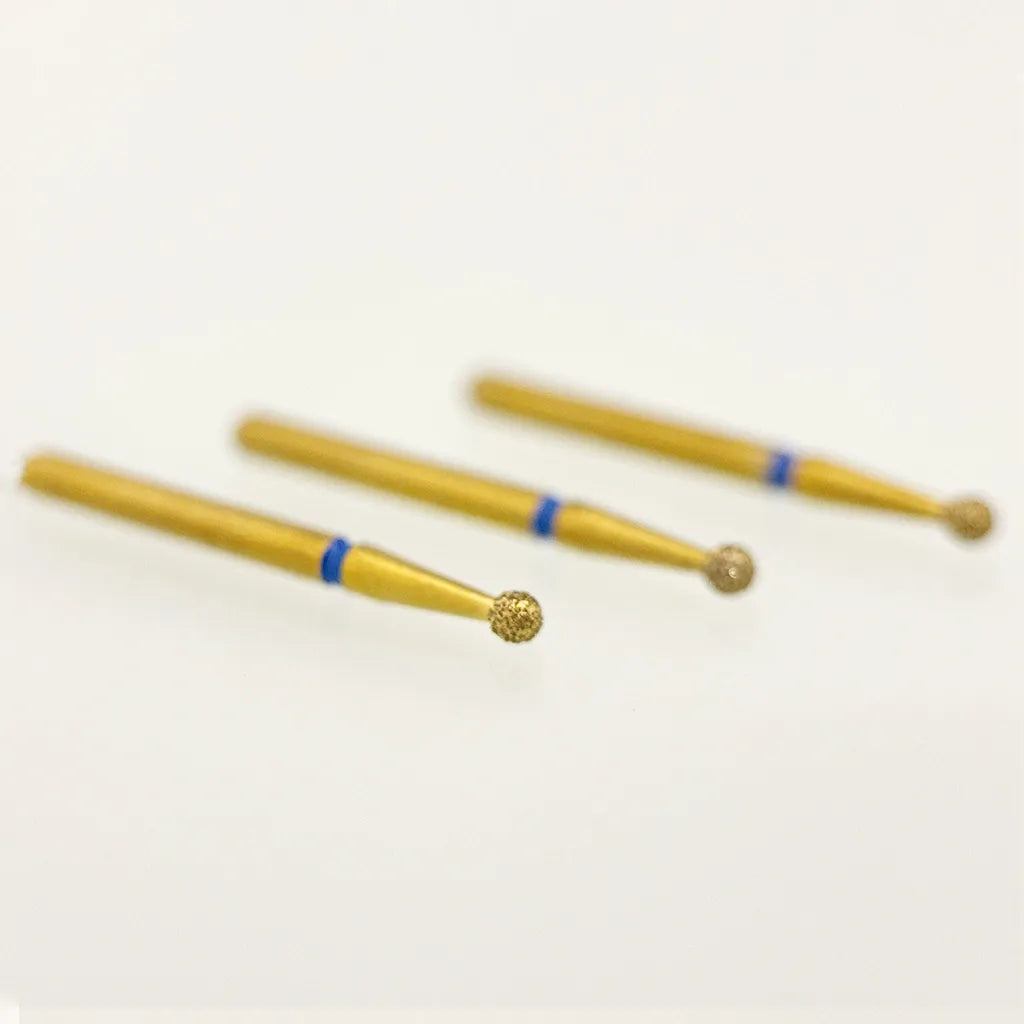 Three gold-colored tools with blue accents on a white background