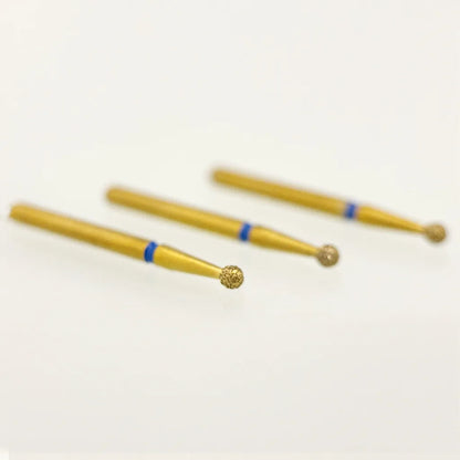 Three gold-colored tools with blue accents on a white background