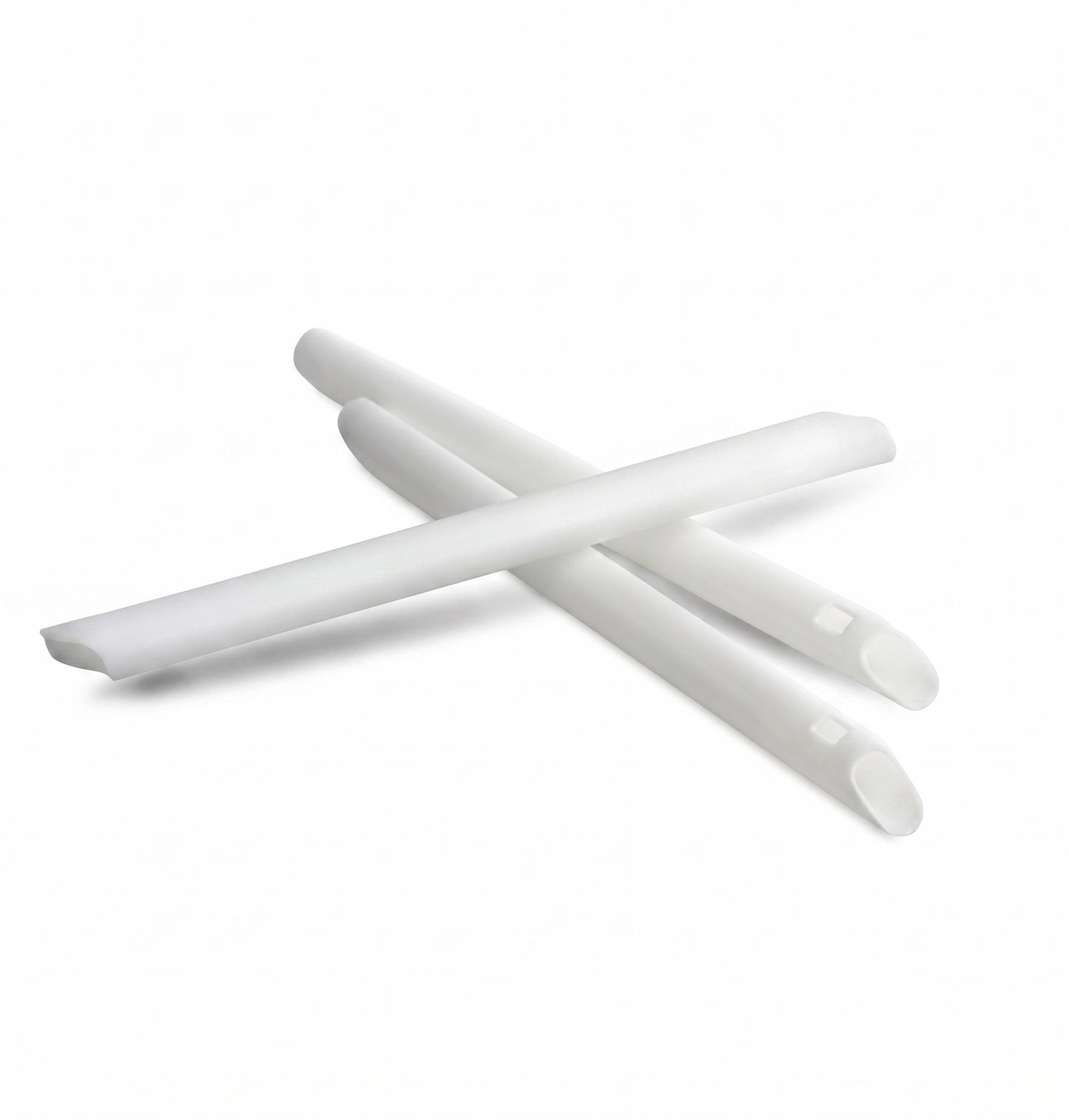 White plastic straws on a white background