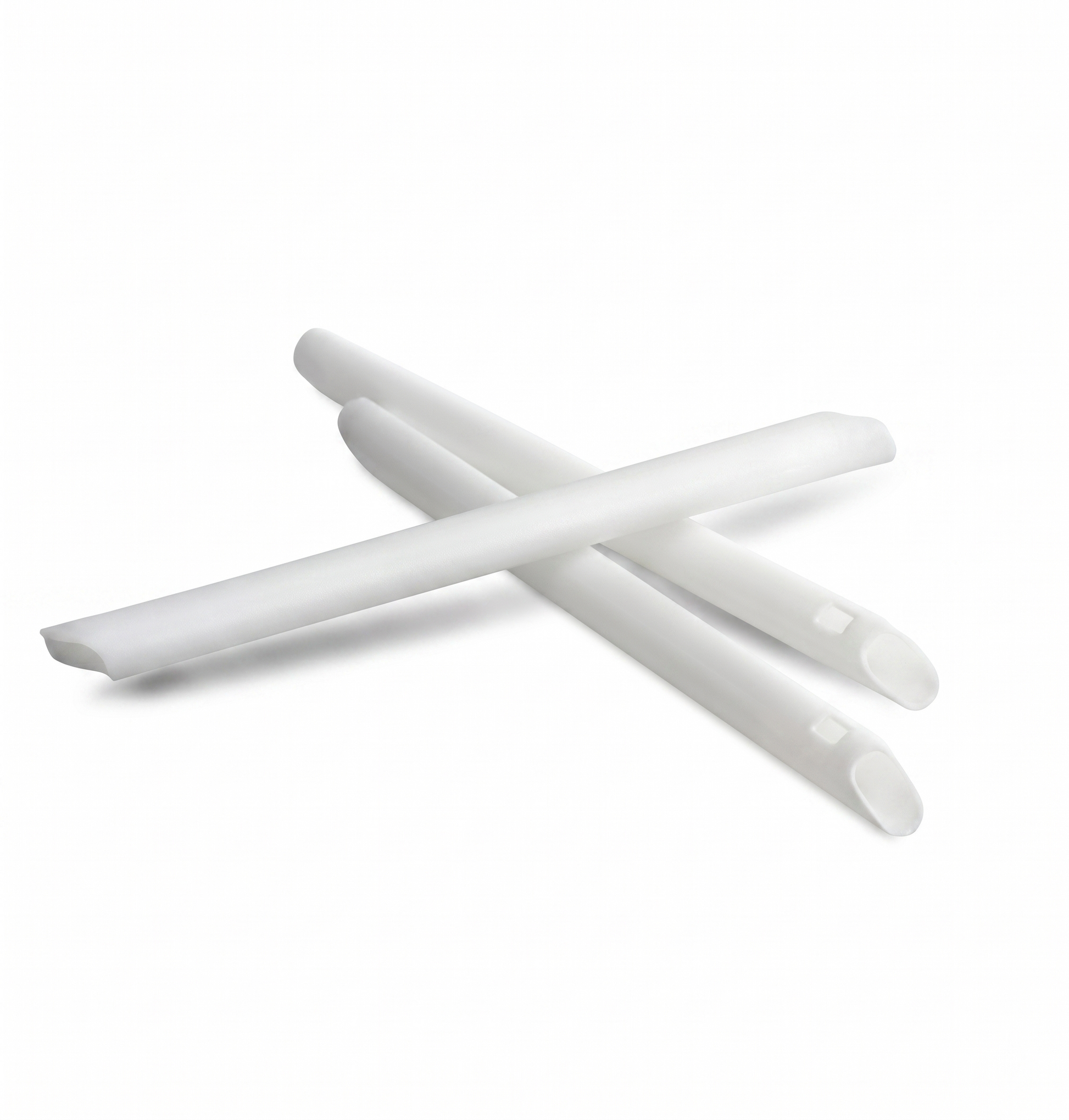 White plastic straws on a white background